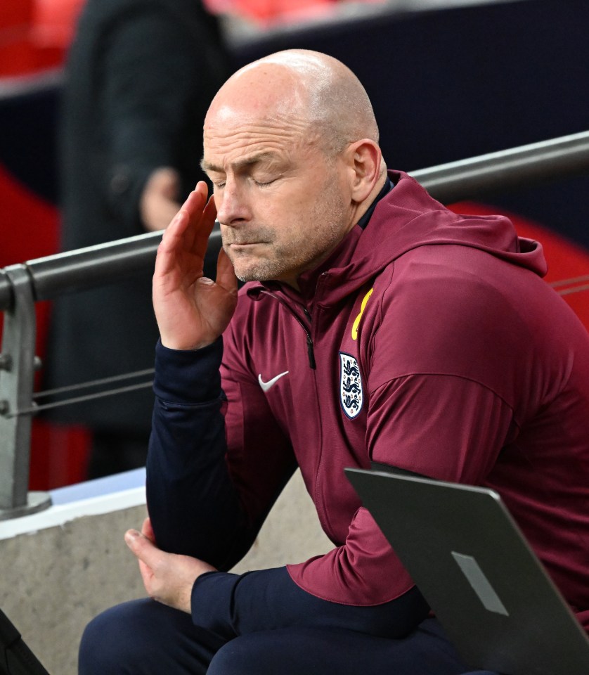 a man wearing a maroon nike jacket with a lion on it