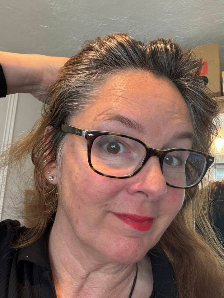 Karin says: 'Sadly, without the magic of hair dye, I’m less Hollywood glam and more granny chic, with each silver strand showing off another hard-earned year'