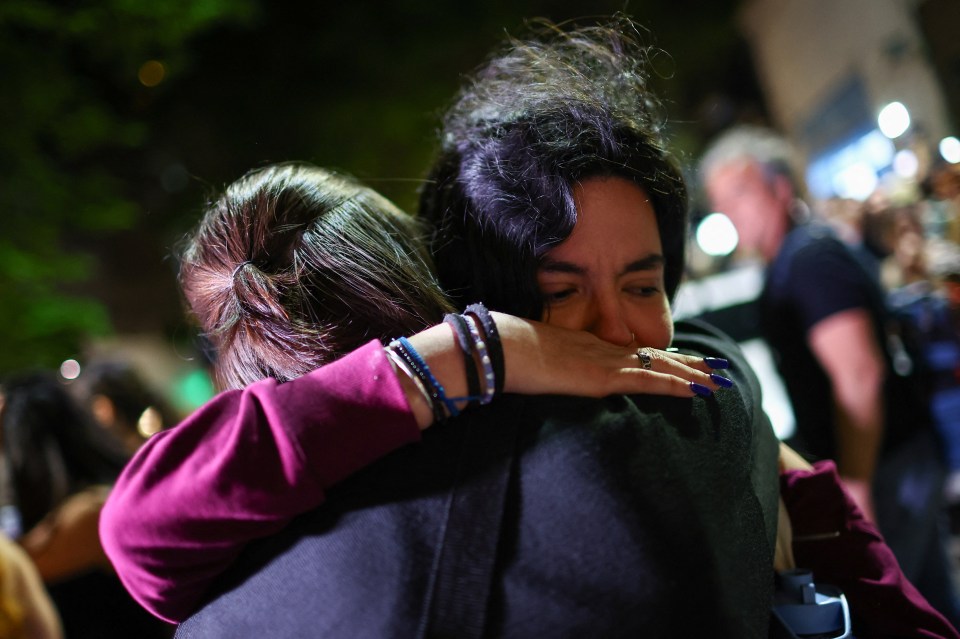 Fans embrace outside the hotel