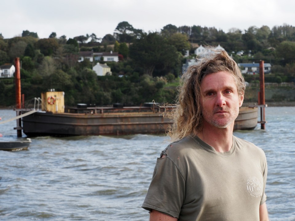 A father-of-one is facing up two years in prison after mooring a barge off the foreshore of a picturesque quay in Cornwall