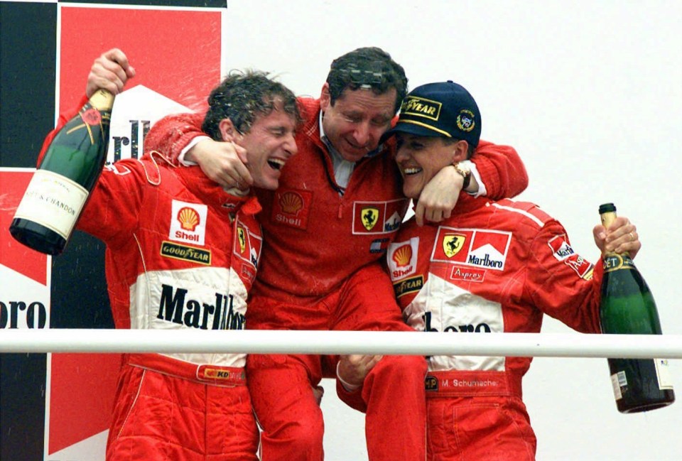 three men are celebrating with a bottle of marlboro champagne