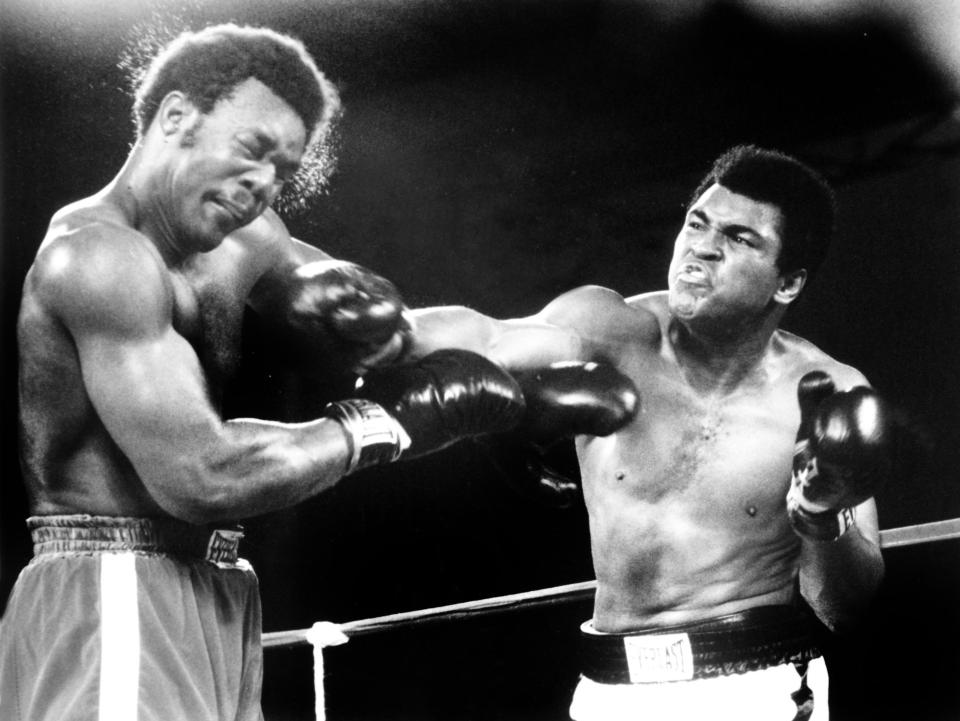 two boxers in a ring with one wearing everlast shorts