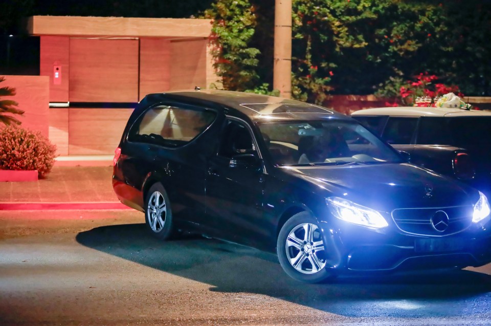 A hearse was pictured outside the property