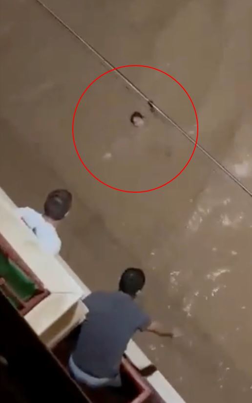 Footage showed one woman desperately struggling in the flood water