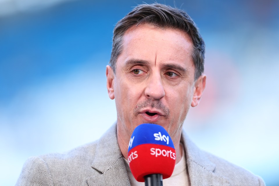 a man speaking into a sky sports microphone