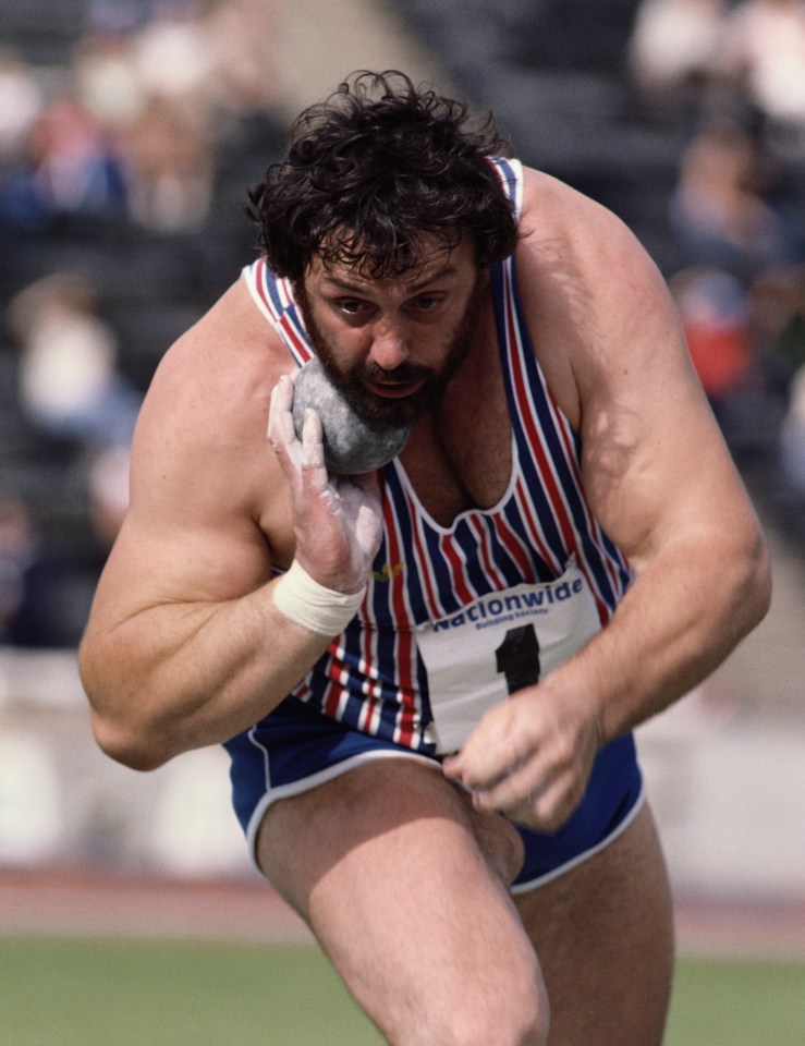 a man in a striped tank top with the number 1 on it