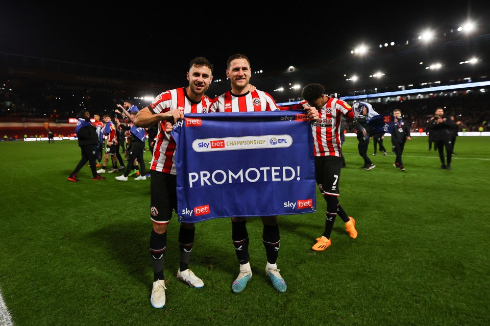 Baldock and Billy Sharp celebrate getting Sheffield United promoted to the Premier League in 2023