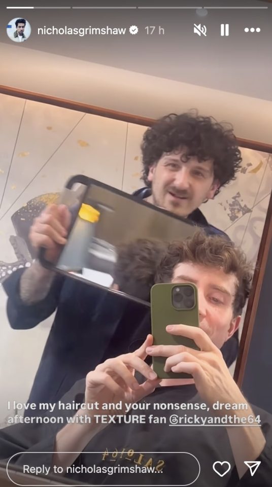 a man taking a picture of himself in a mirror with the name nicholas grimshaw at the top