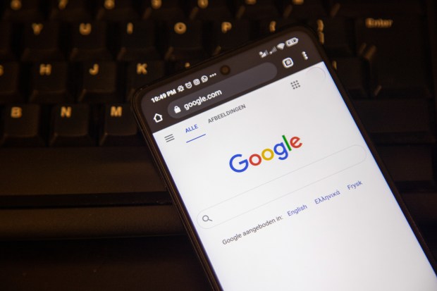 a phone is open to a google search page