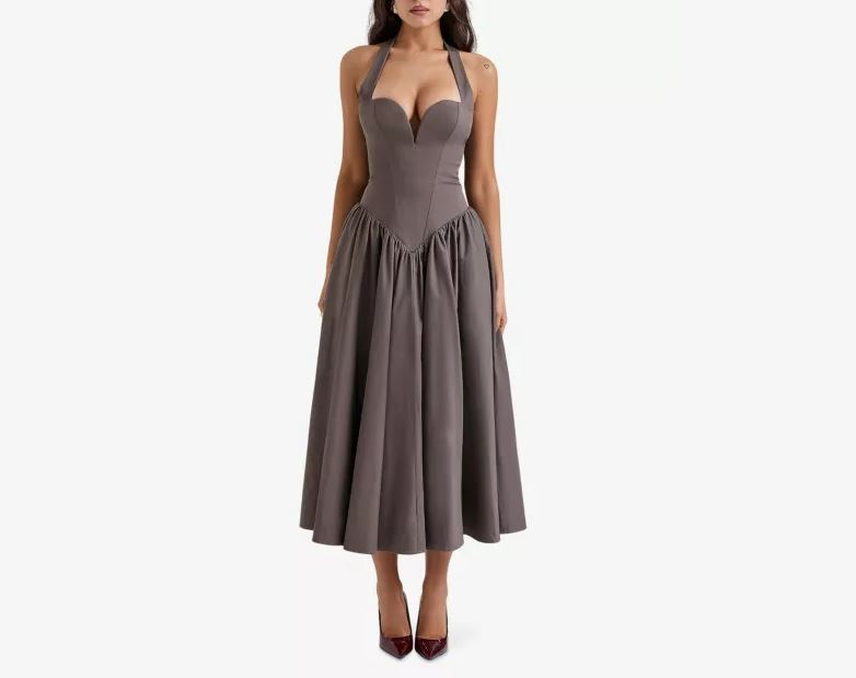 a woman is wearing a grey dress with a plunging neckline