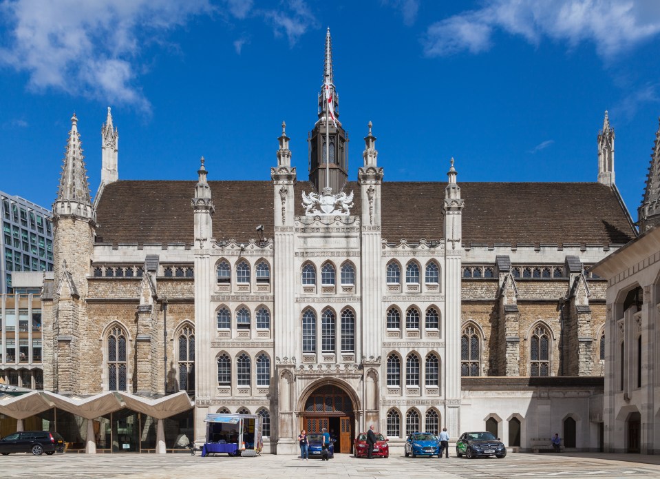 a large building with a coat of arms on the top of it