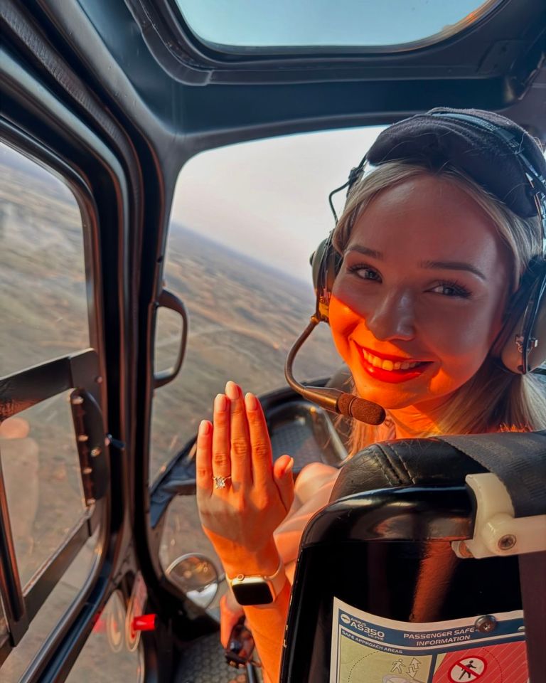 Gina flashed her rock while they flew in a helicopter