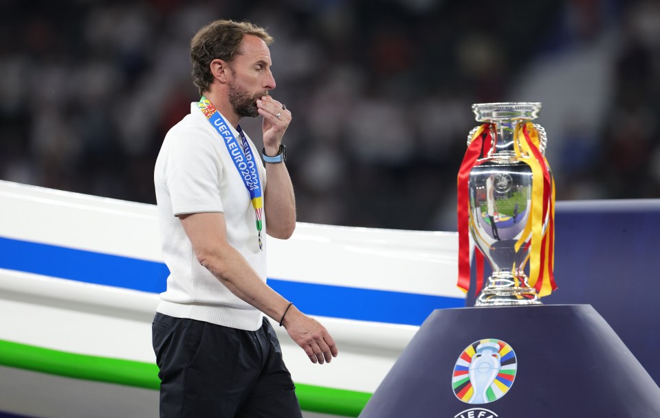 a man with a medal around his neck that says uefa euro 2020