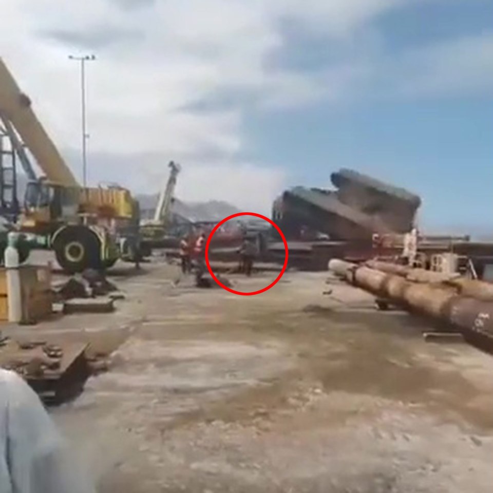 The worker made a quick escape before the machinery became crushed on the ground