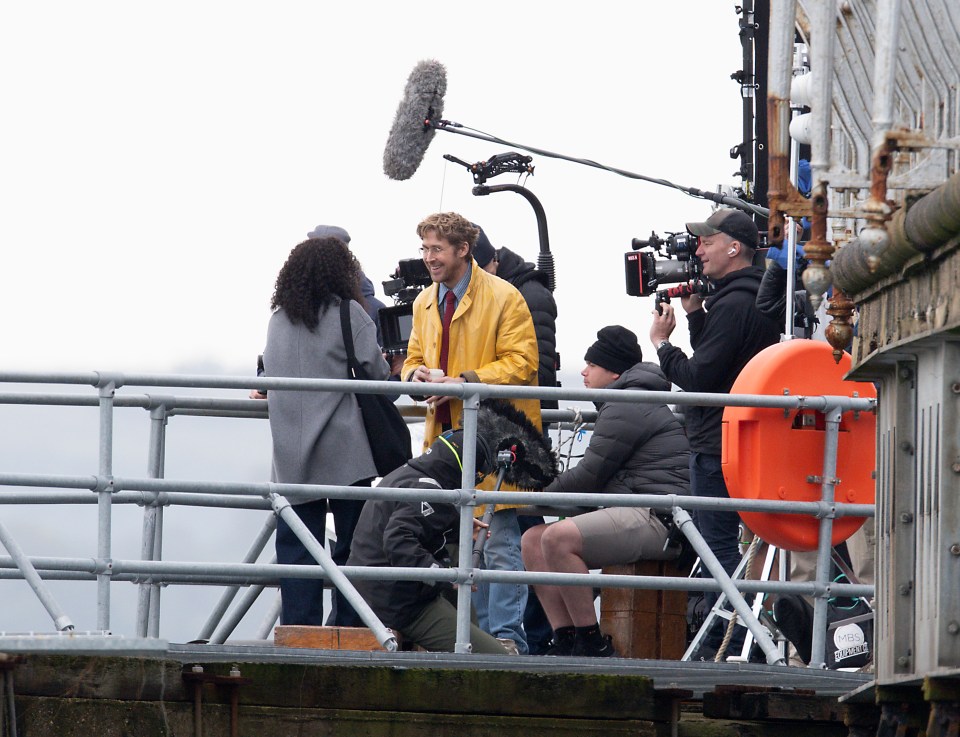 The star looked into good spirits as he filmed on the pier that has been transformed into a film set