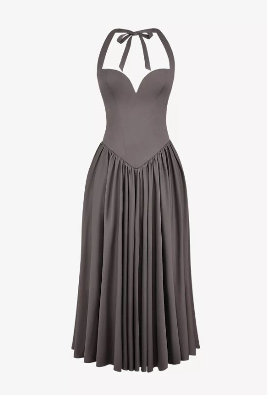 a grey dress with a halter neckline and a pleated skirt