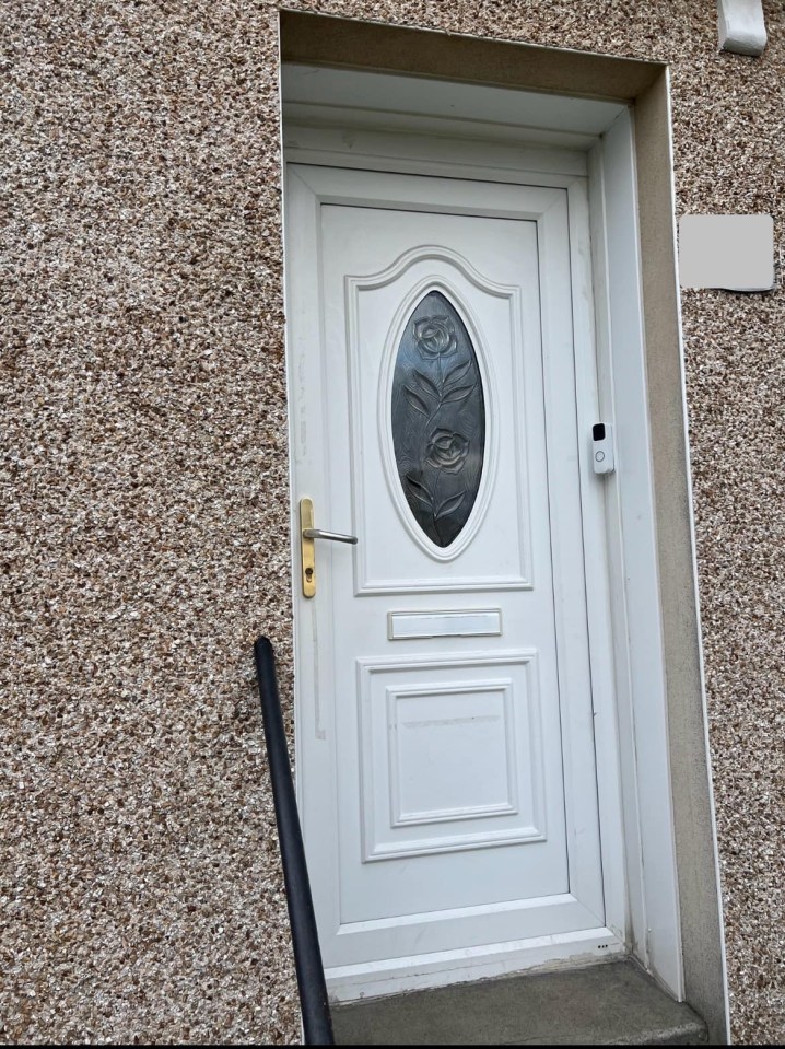 a white door with a floral design on it