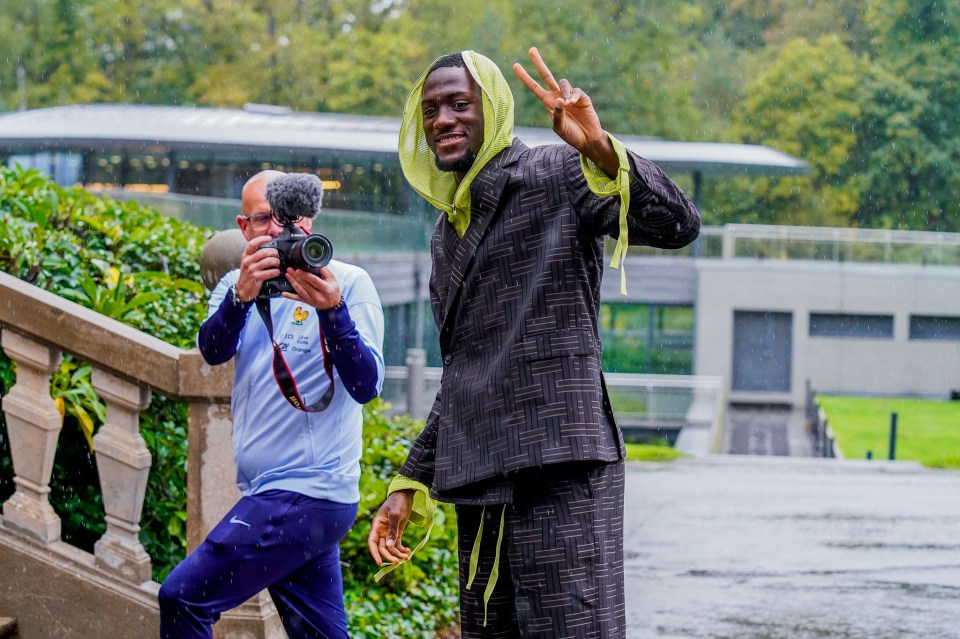 He struck a pose before heading into France's Clairefontaine training base