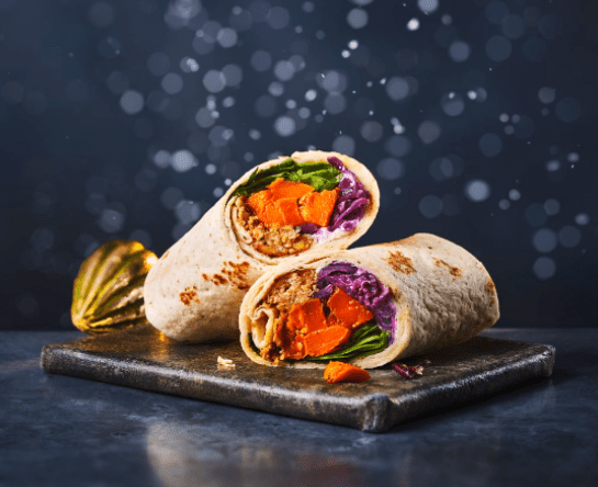 The new 'Very Merry Veggie Roast Wrap', which costs £3.80, contains roast squash, pickled slaw, spiced veggie and seed balls, spinach, and vegan garlic mayo