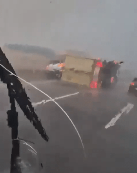 Footage captured the overturned truck on a busy motorway