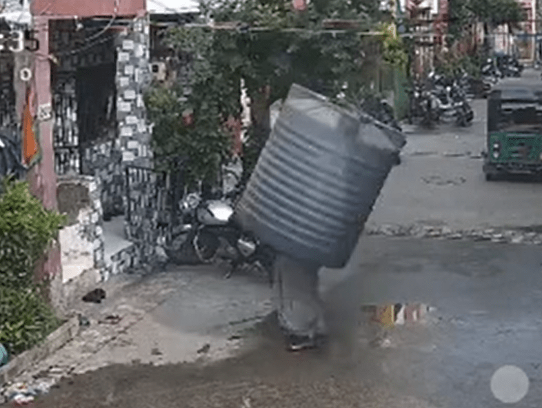 The tank landed perfectly on the woman leaving her trapped inside