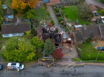 The remains of a house explosion and subsequent fire