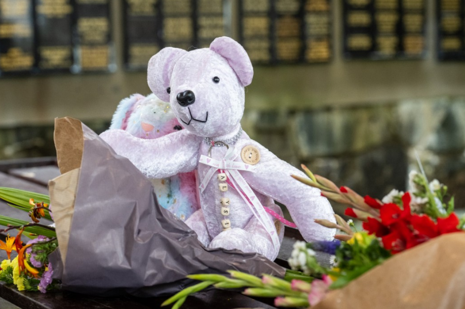 All lighters had been banned from the house, except one kept in the eldest daughter’s bedroom, secured in a locked click box (pictured: Tributes left for Alysia)