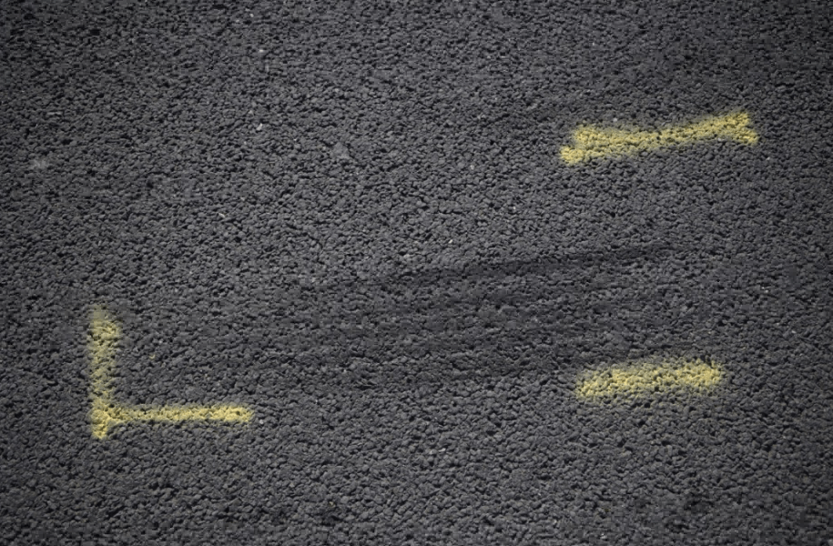 Tire tracks marked on the road by the police at the junction between the A20 and Kidbrooke Park Road in Eltham, south London