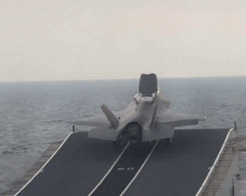 A jet taking off from an aircraft carrier