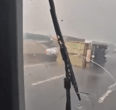 A slew of vehicles lying on the storm-battered motorway