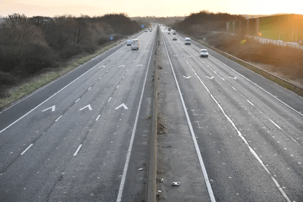 a highway with arrows pointing in opposite directions