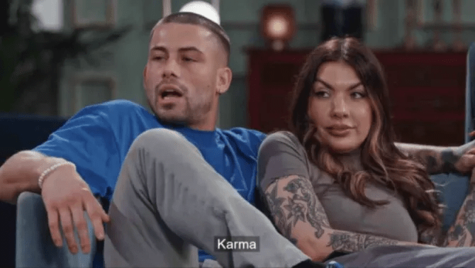 a man and a woman are sitting on a couch with a caption that says karma .