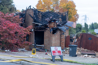 The unexplained blast sparked a fire at the home in Bedford