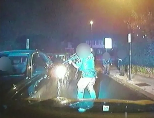 Video footage shows the moment armed officers surrounded his car before the police shooting