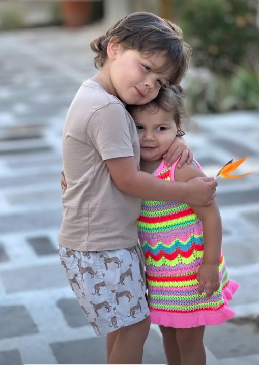 The pair's kids were seen enjoying a cute hug