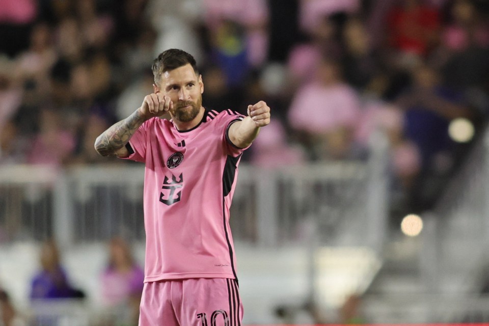 a soccer player wearing a pink shirt with the number 10 on it