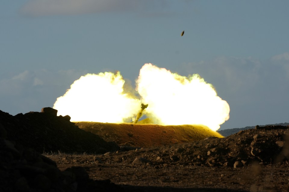 An Israeli mobile artillery unit fires a shell from northern Israel towards Lebanon