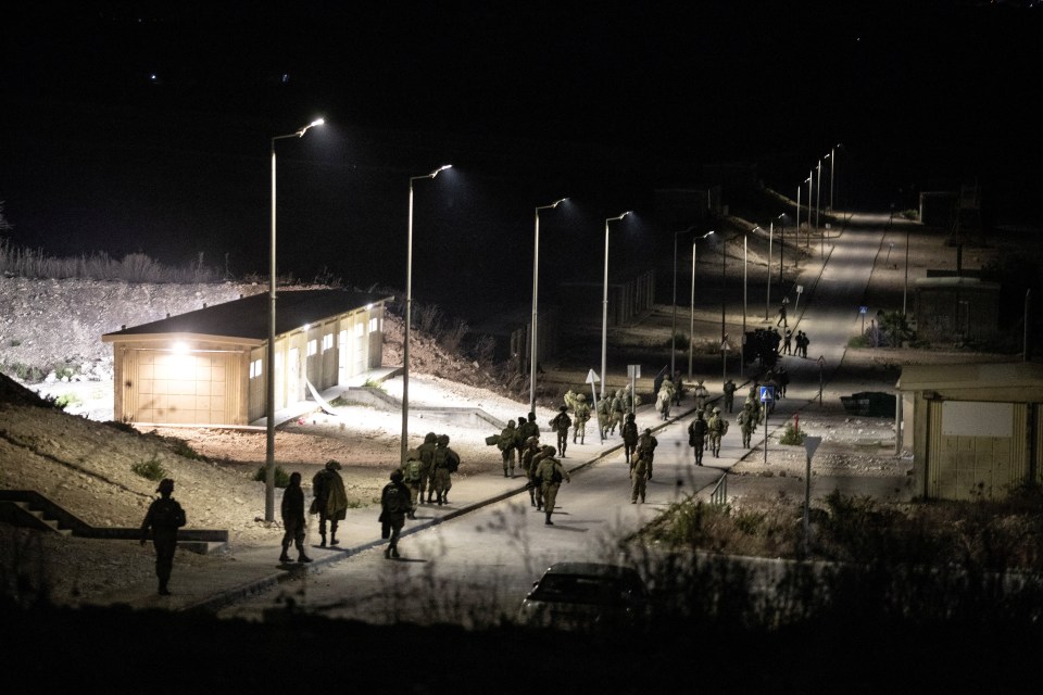 People evacuating a military base near Binyamina - after a Hezbollah drone strike killed four soldiers there