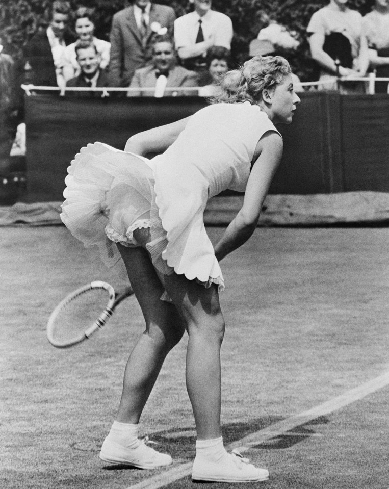 Pericoli returns a ball during Wimbledon in 1955