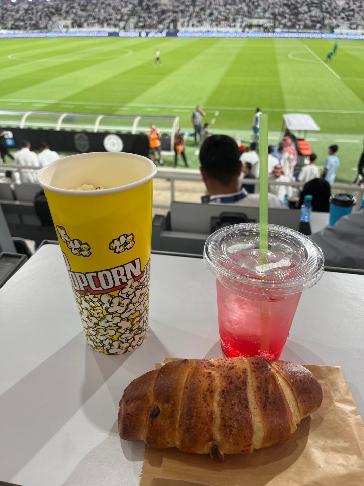 We settled for a cheese croissant, popcorn and cherry soda