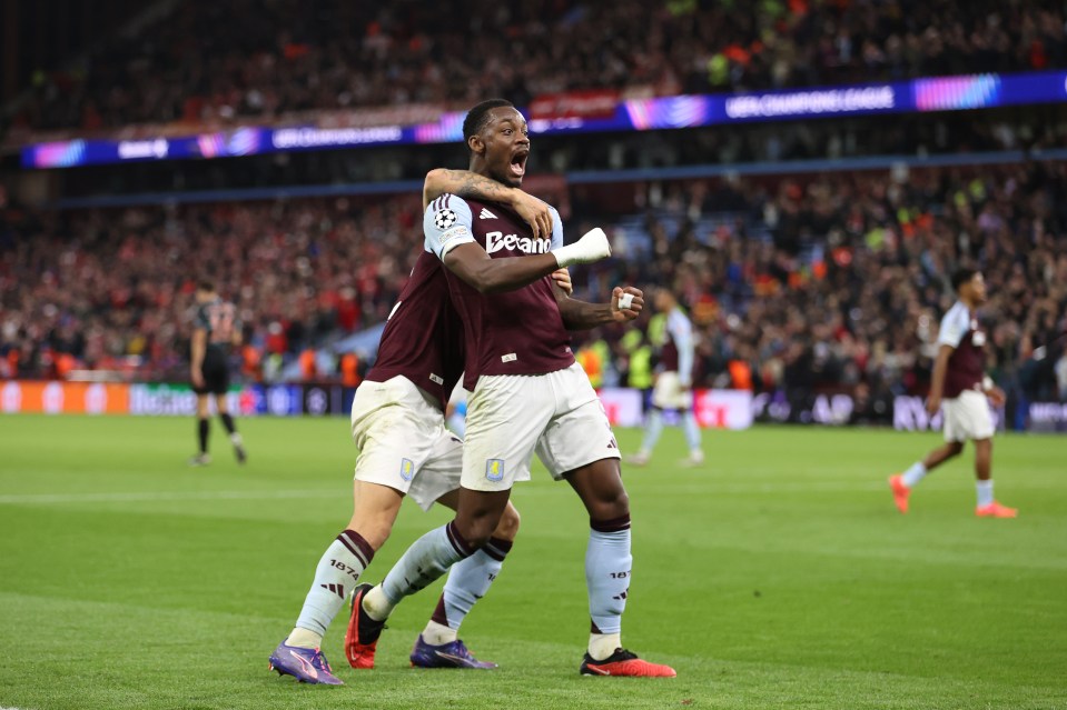 two soccer players on a field with one wearing a jersey that says beam