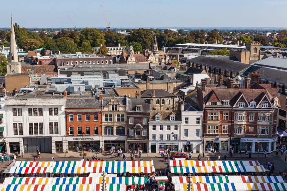 an aerial view of a city with a m & s foodhall store in the background