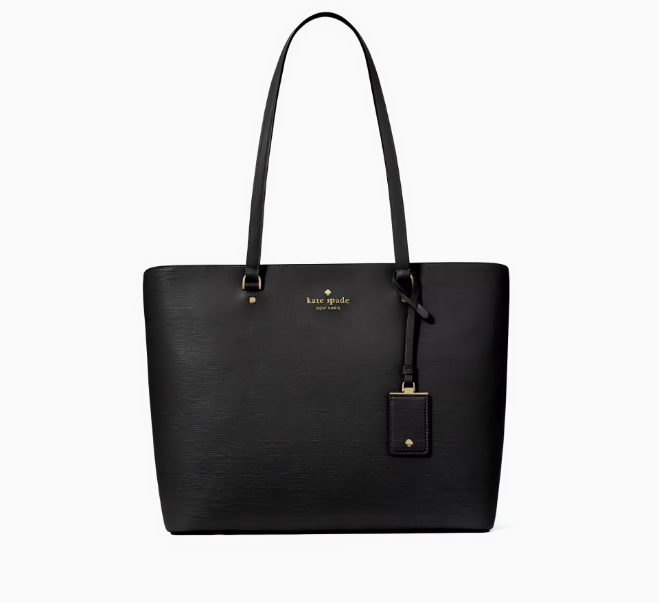 a black kate spade tote bag on a white background