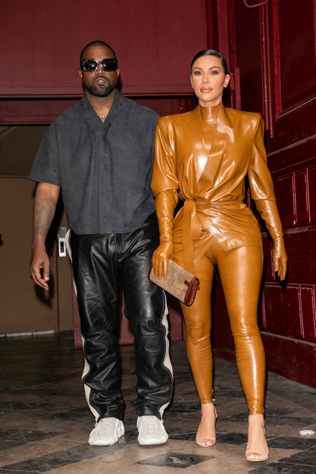 kanye west and kim kardashian are standing next to each other