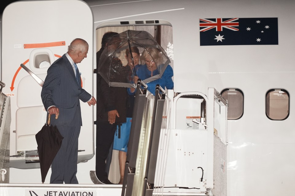 The royal couple were caught in wet and windy weather as they arrived for the nine-day tour