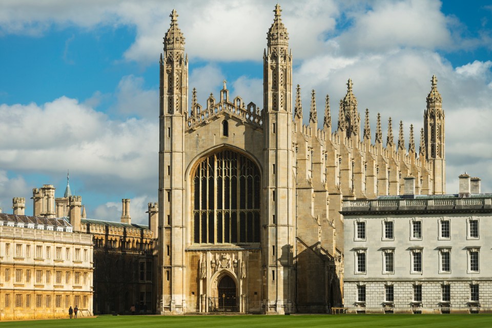 a large building with a blue sky in the background