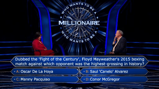 a man and woman are on a television show called who wants to be a millionaire