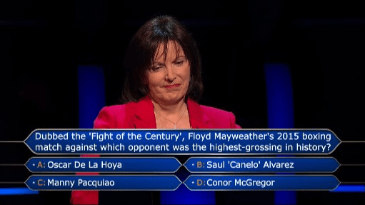 a woman is answering a question about floyd mayweather 's 2015 boxing match