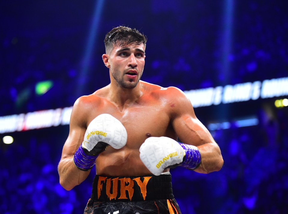 a boxer with the word fury on his belt