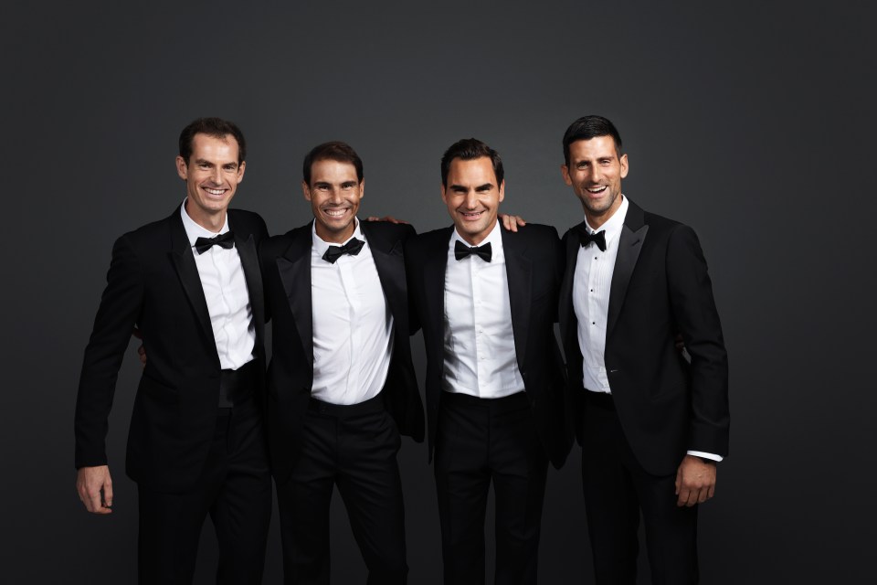 four tennis players are posing for a picture including roger federer and rafael nadal